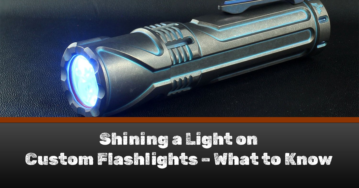 A Focusworks flashlight on a black table - a great example of custom flashlights.
