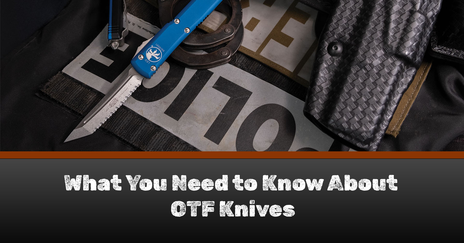 OTF knives sitting on a table surrounded by military gear.